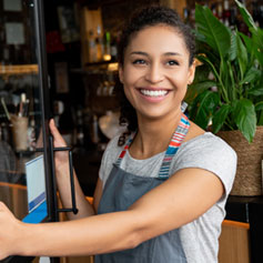 woman with apron on and smiling