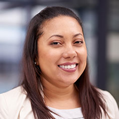 woman smiling staring at the camera